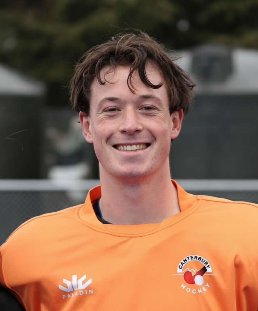 Louis Beckert wearing an orange shirt